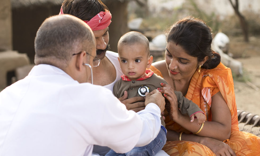 photo of mother holding baby